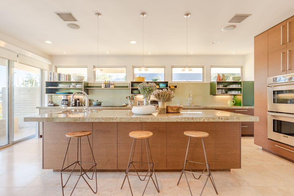 Kitchen and elegant stone island. 