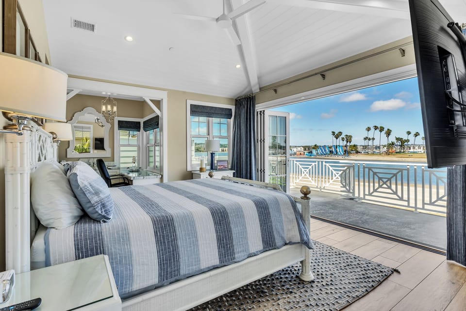 Wake up to stunning bay views from your private waterfront retreat