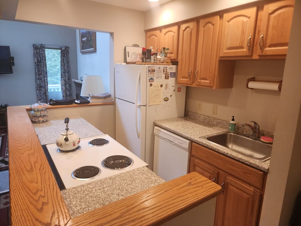 Galley kitchen has dishes for ~12, single serve Keurig, and plenty of pots/pans