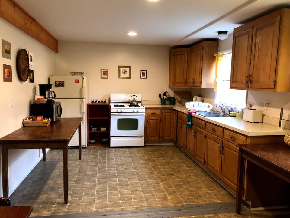 Kitchen w/cookware and place settings for 28, microwave, coffee maker and more