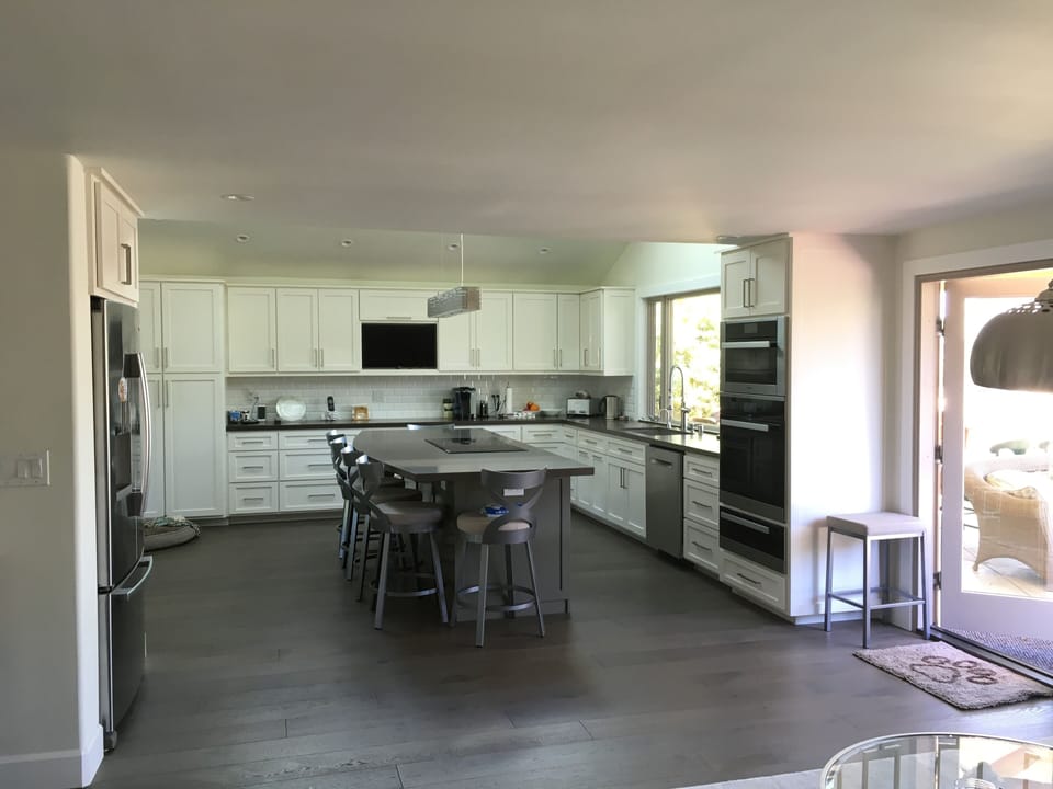 Kitchen with Miele oven appliances and 6 person island  