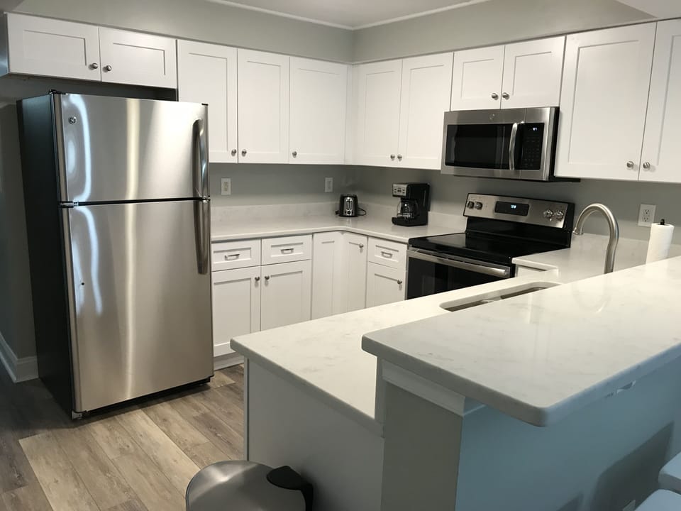Newly renovated kitchen including brand new custom cabinets
