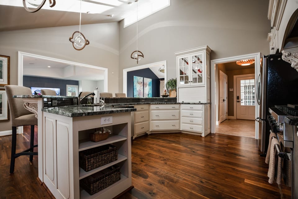 Island Kitchen with a bars that seats 5. Gas range, granite countertops