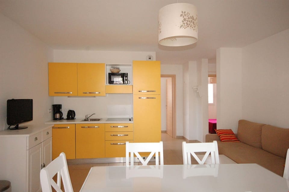 Relax in the colourful open-concept living area.