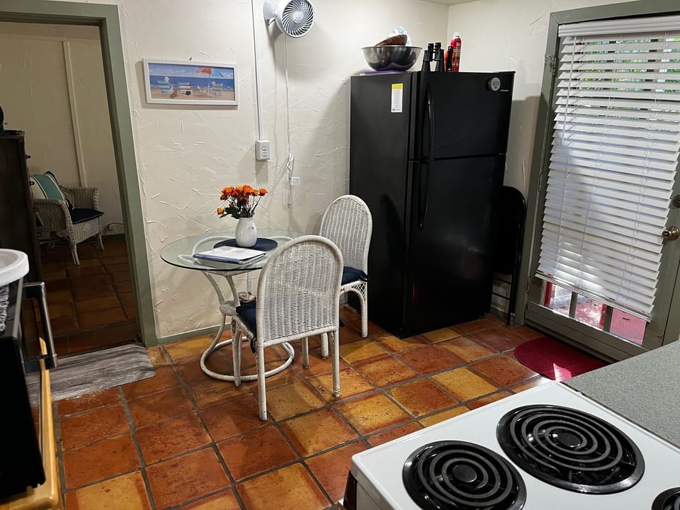 Kitchen features full-size refrigerator, apartment size stove, microwave & more.