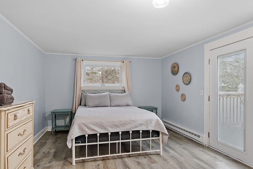 Bedroom 2 with doors leading directly onto back porch!