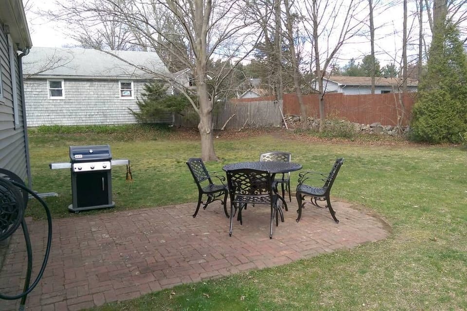 There's plenty of space in the backyard to grill and chill all day long. 