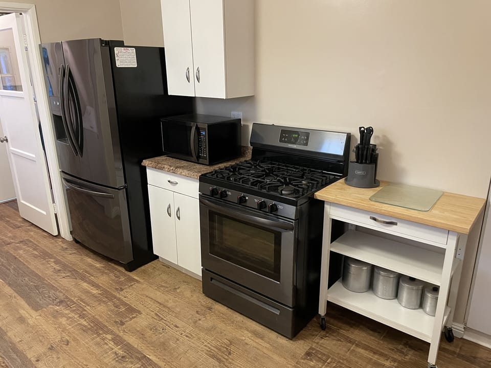 Kitchen - coffee pot, microwave, new double door fridge with ice maker. 