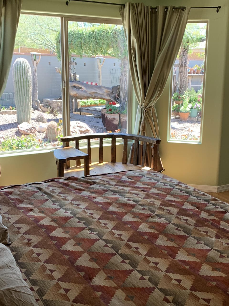 Backyard bedroom view birds in morning come to waterfall.