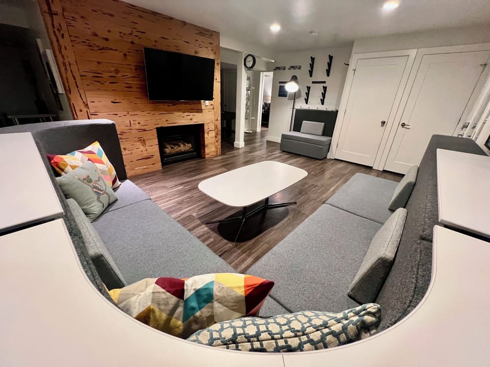 Hang out together in the great room. Bar height table on the backside of a couch