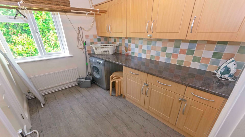 Utility room with washing machine