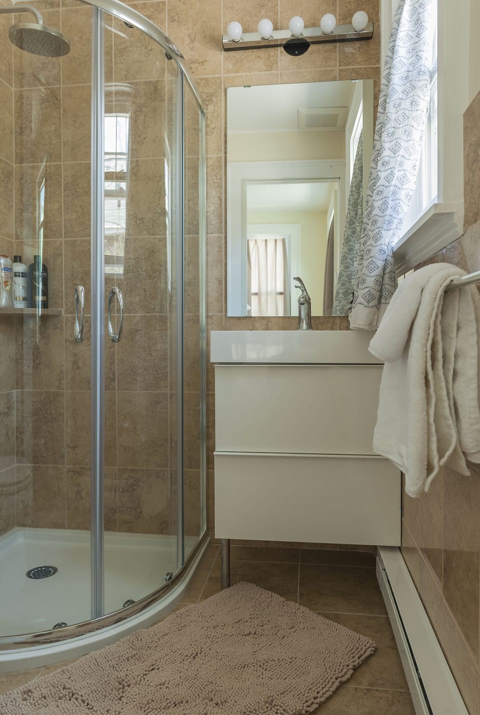 Newly renovated bath with shower.