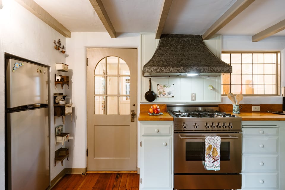 Kitchen with laundry room beyond the door.