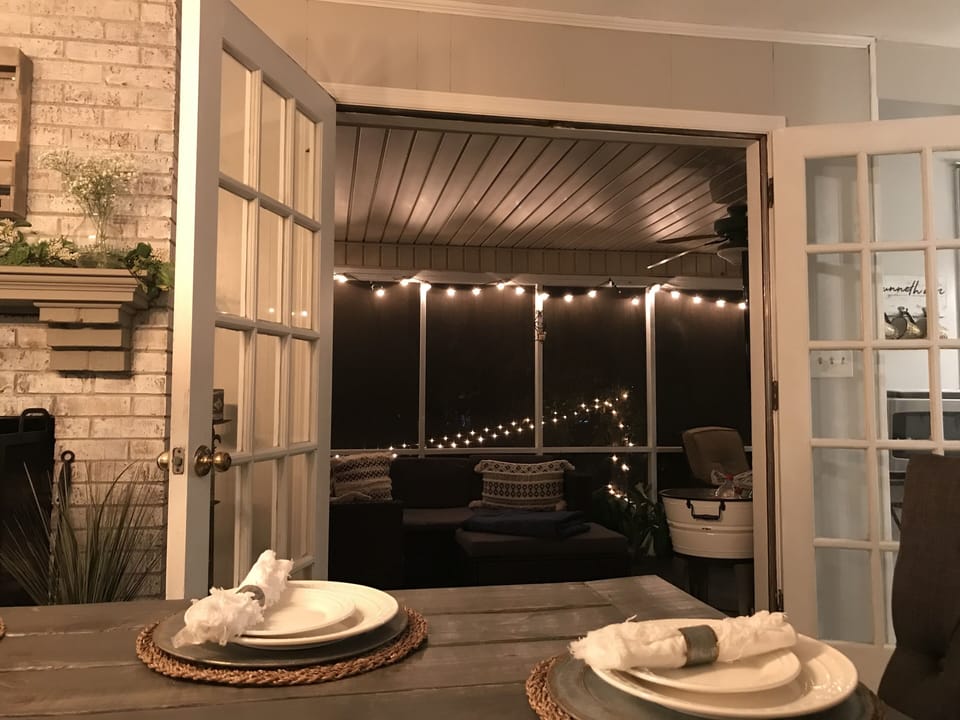 Dining room opens to amazing screen porch with additional seating for four