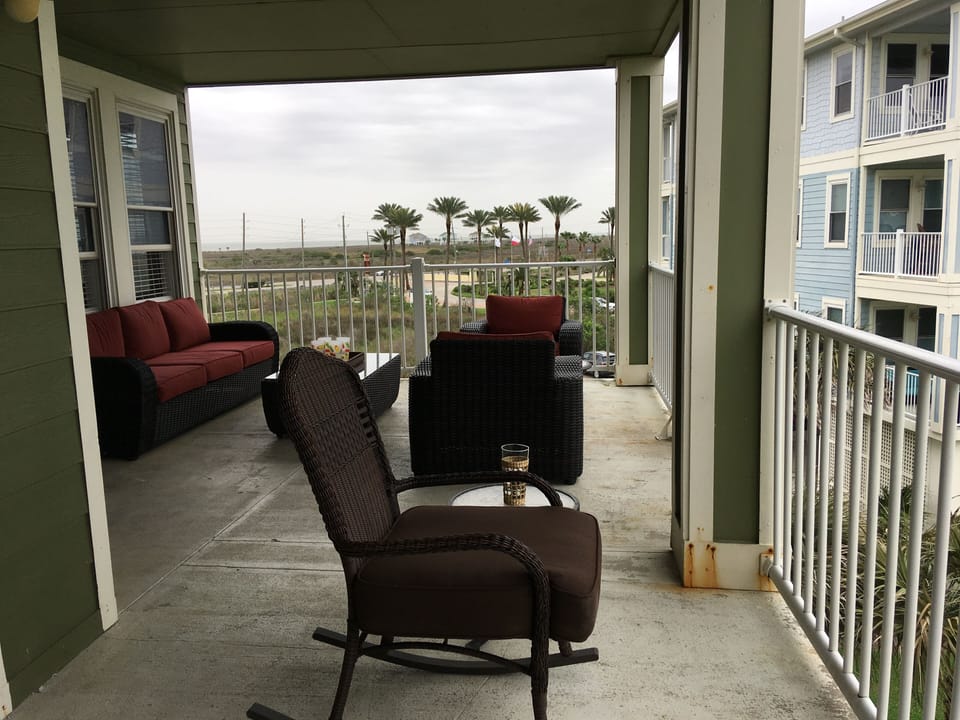 Large balcony has plenty of seating for looking at the beautiful views.