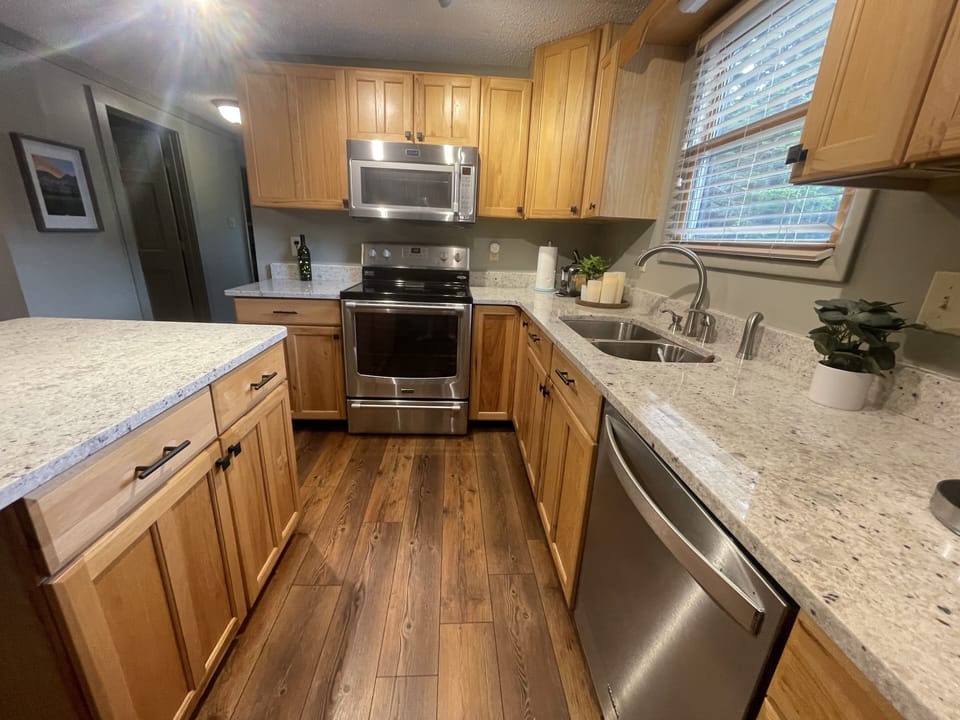 Chef's fully stocked kitchen with blender, crock post, Keurig, waffle maker, etc