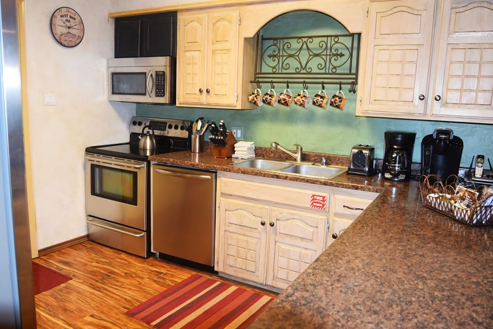 Your fully equipped kitchen invites you to brew fresh coffee, whip up your favorite meals, and gather around the spacious countertops with everything you need at your fingertips.