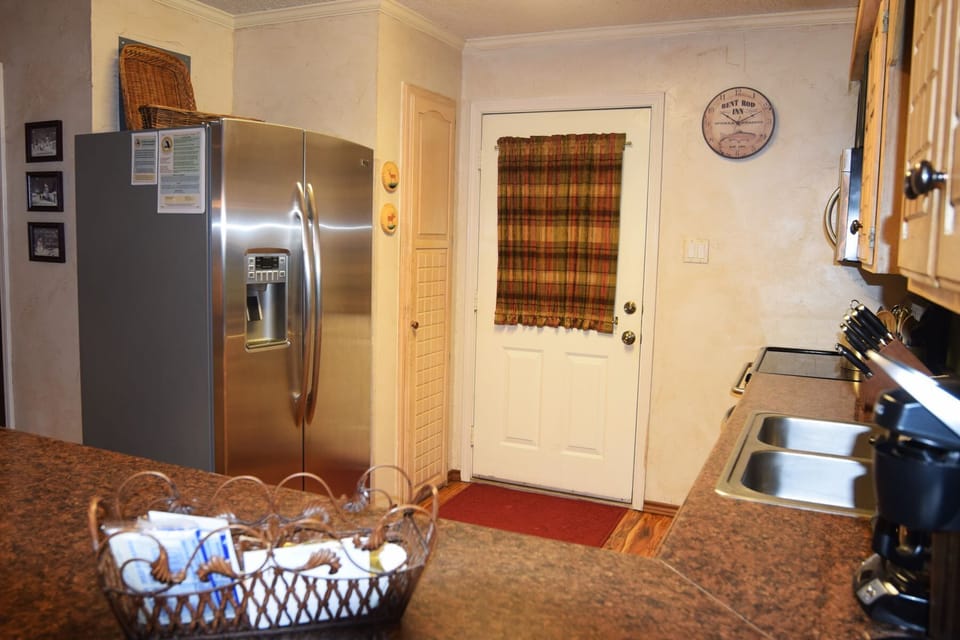 Your fully equipped kitchen features stainless steel appliances and granite counters, giving you all the comforts of home for preparing your favorite meals during your stay.