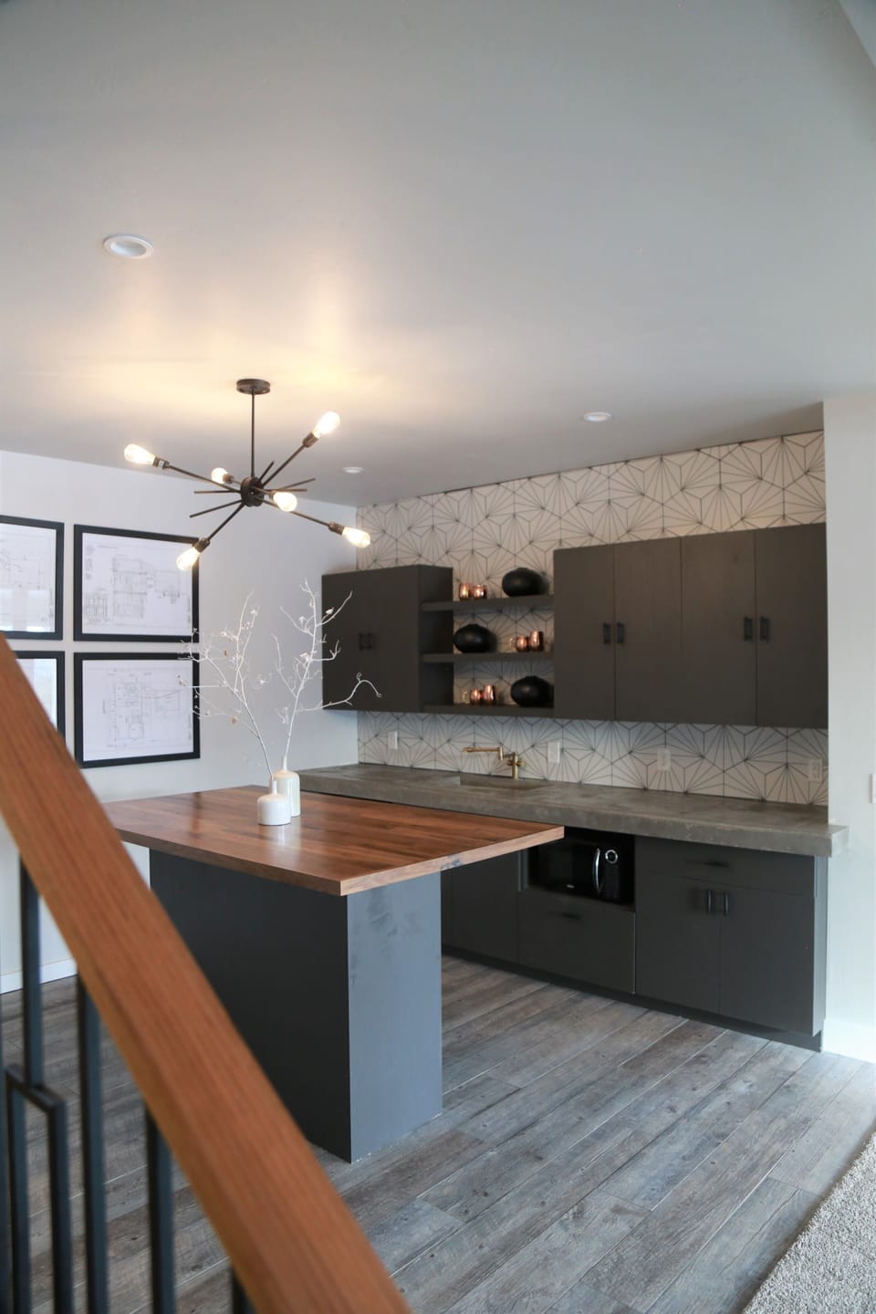 Bar: framed Summit architecture, mini fridge, micro., concrete counter and sink.