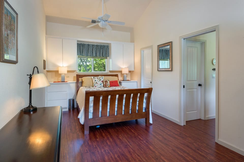 The bedroom has a king bed and ensuite bathroom