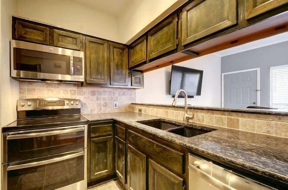 Under-mounted sinks and new Moen faucet.