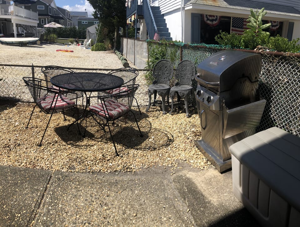 Outside dining area with grill is exclusive to our unit