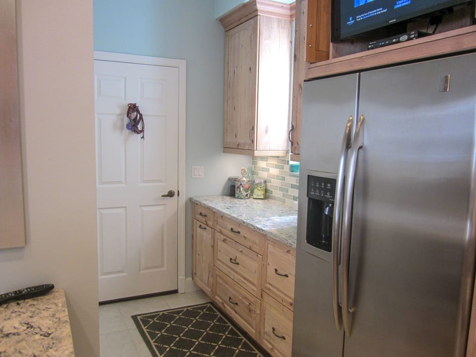 Entry to two car garage with washer and dryer