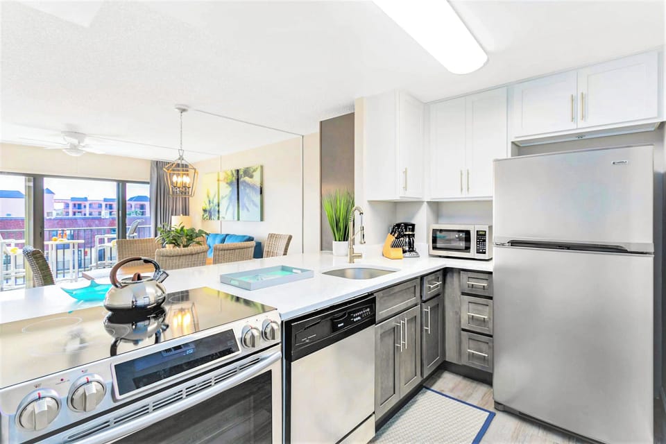 Cook with ease in a modern kitchen with quartz counters and sleek appliances