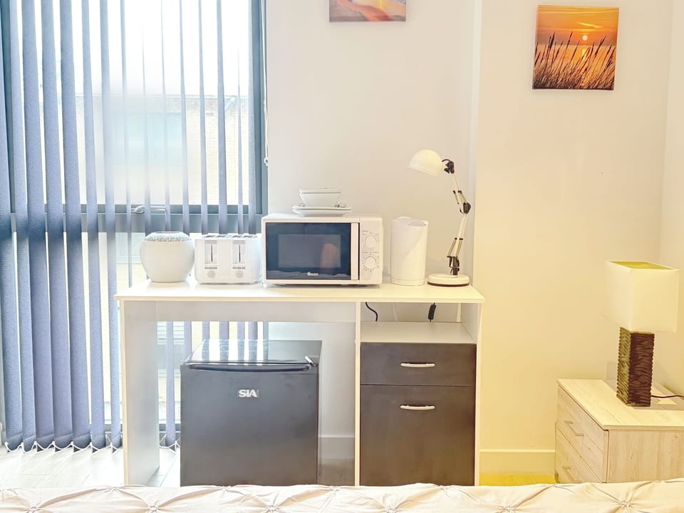 The third bedroom “Orange Room” (with bathroom), with a brand new kitchenette