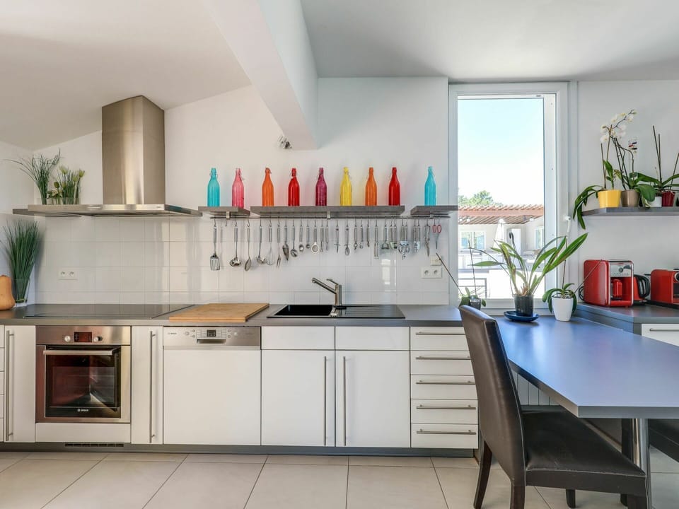 Cabinetry, Property, Countertop, Furniture, Bottle, Product, Plant, Kitchen, Wood, Houseplant