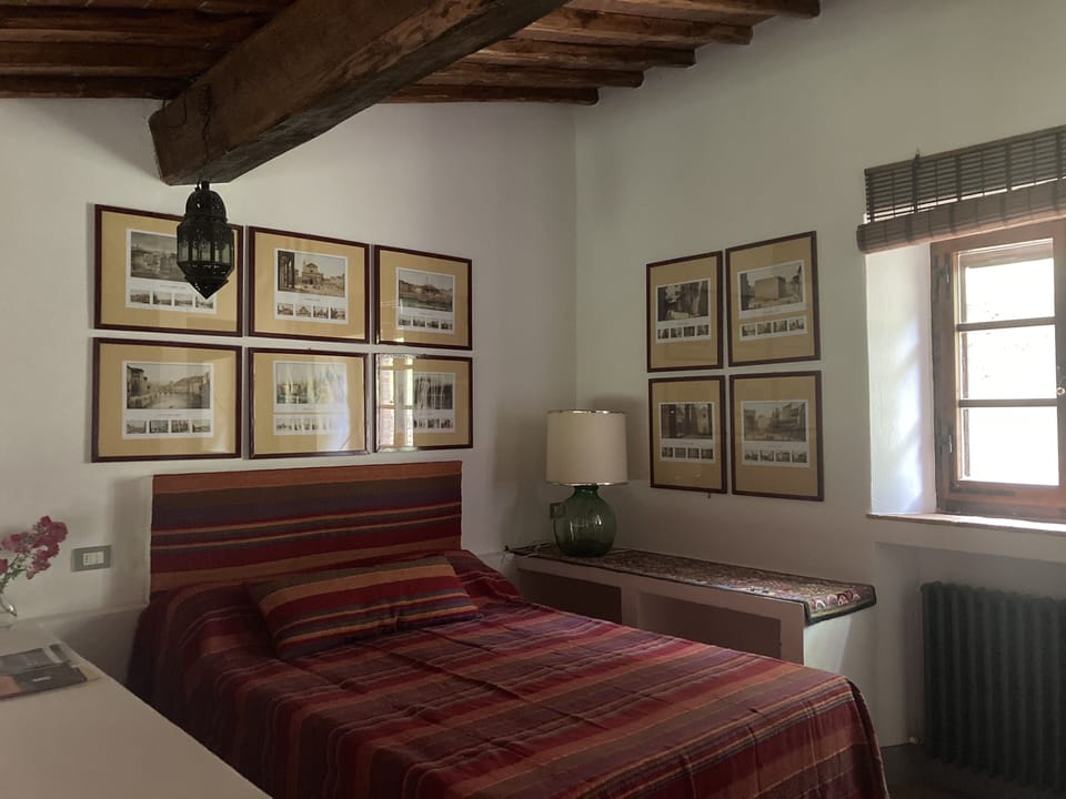 Double bed on balcony in Capanna