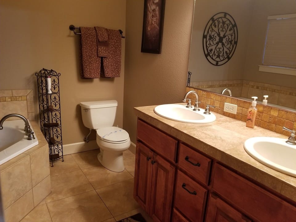 Moonbeams master suite bathroom with double sinks, jetted tub & walk-in shower!