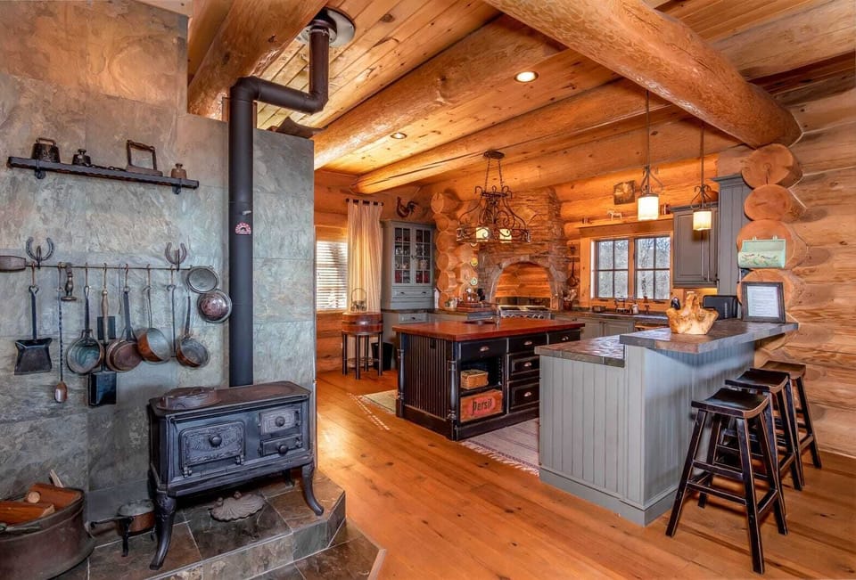 Kitchen with custom gas cooktop, bar stool dining for 3 more!