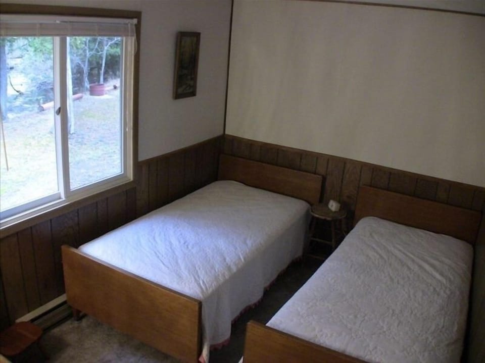 The smallest bedroom, a river view, twin beds across the hall from master bath 