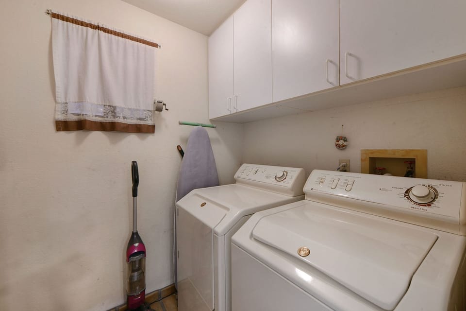 Laundry room with washer and dryer.