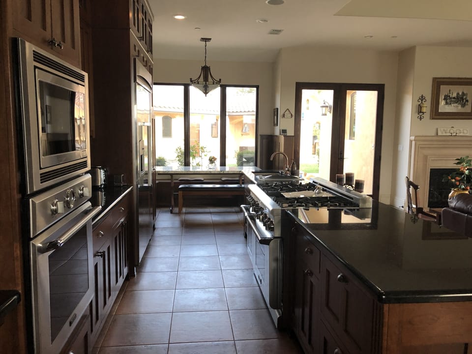 Built-in kitchen table at far end. 