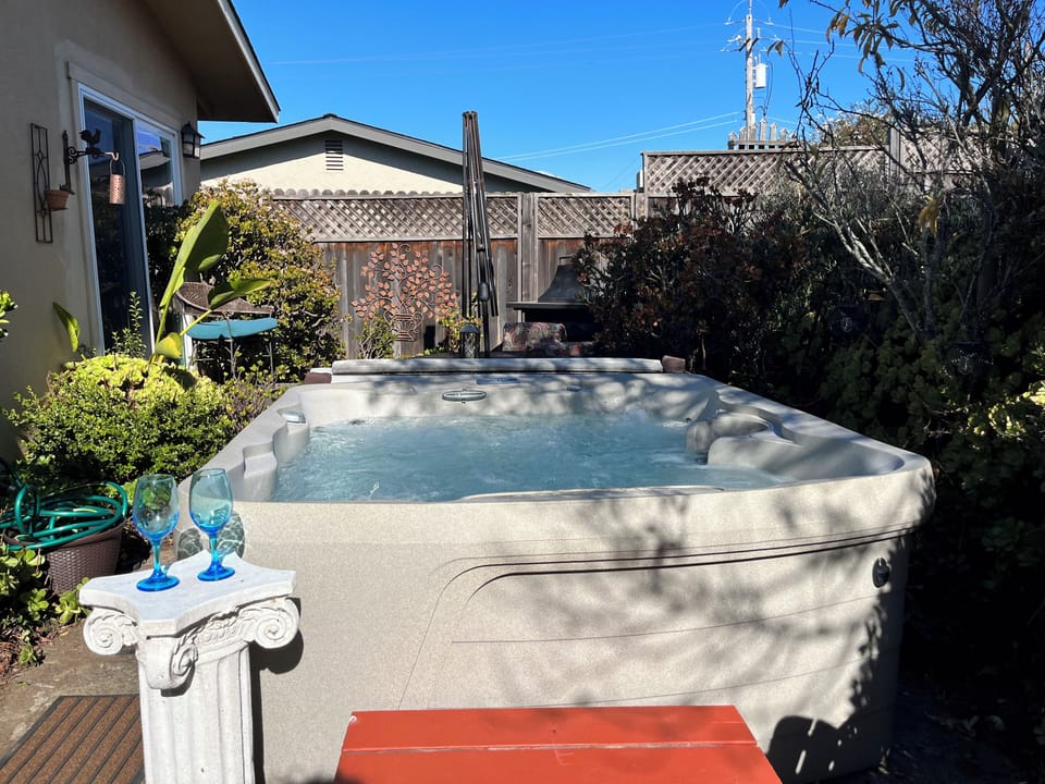 Newer Hot tub with water fall & fun lights.  Located rear of house for privacy.