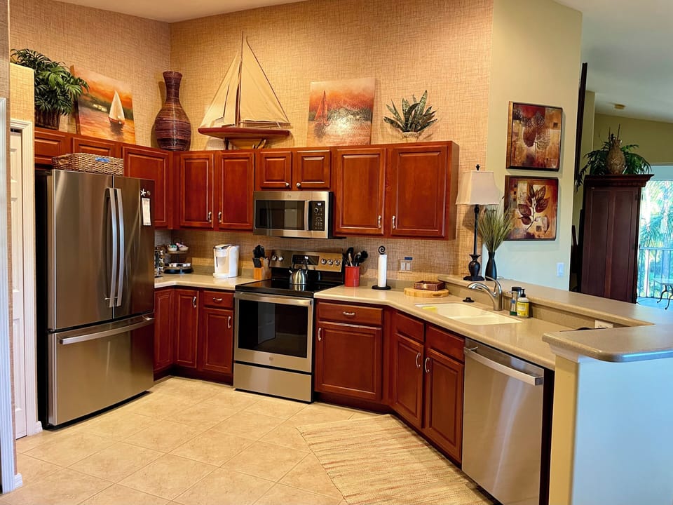 Large fully equipped kitchen with new GE Profile appliances.