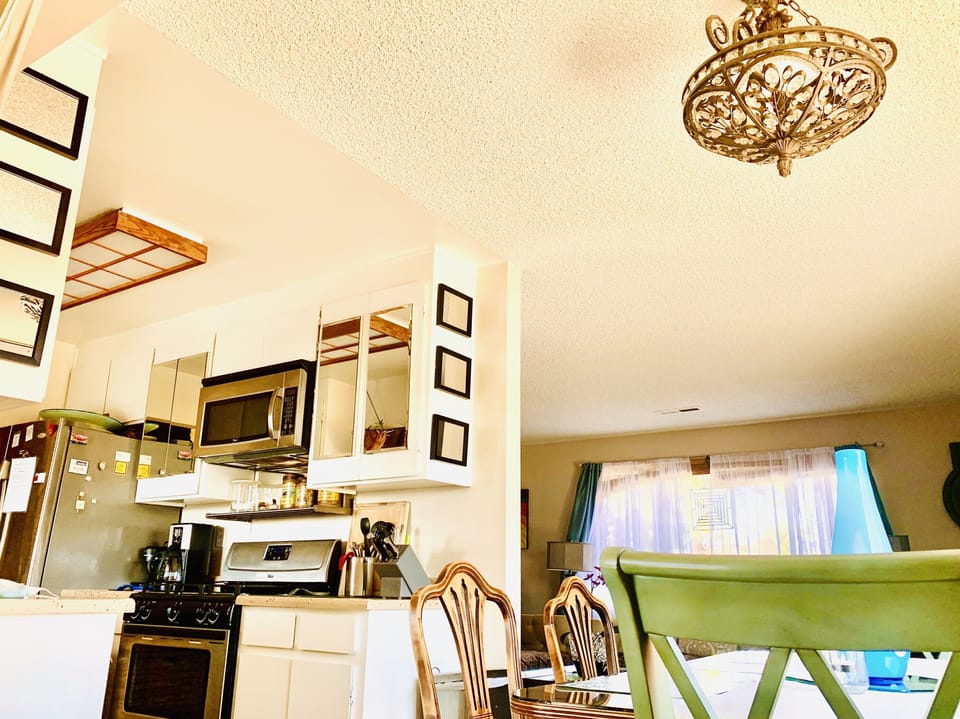 Galley kitchen w/ bayviews, gas stove & stainless appliances inc dishwasher 