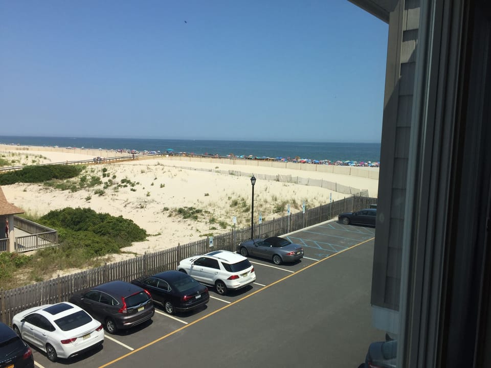 Beautiful ocean view from the bedroom - just steps to the private beach! 