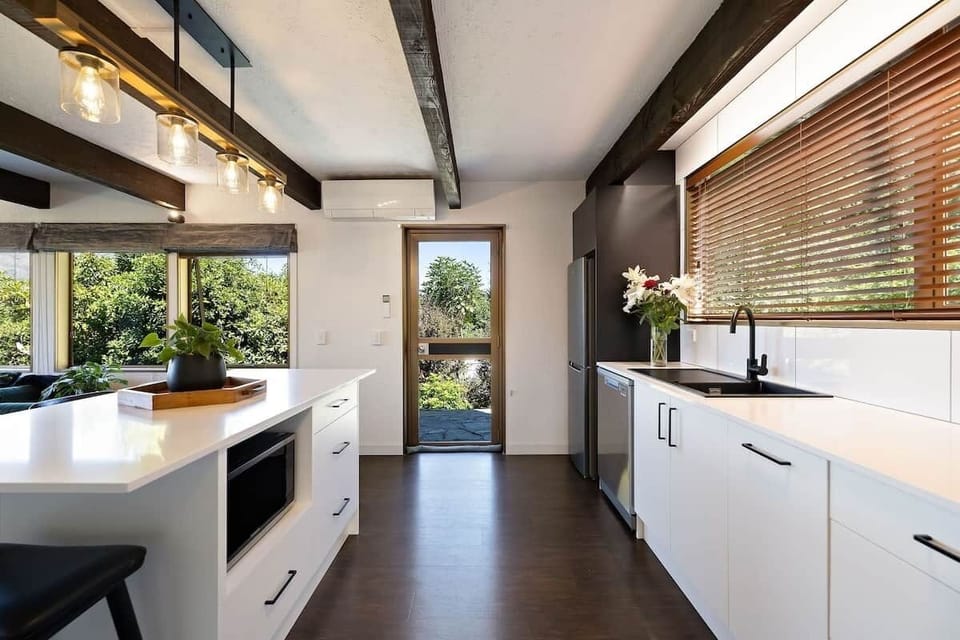 Open plan kitchen and living at Walk to Town 39A Alpine Chalet Lomond Crescent Queenstown