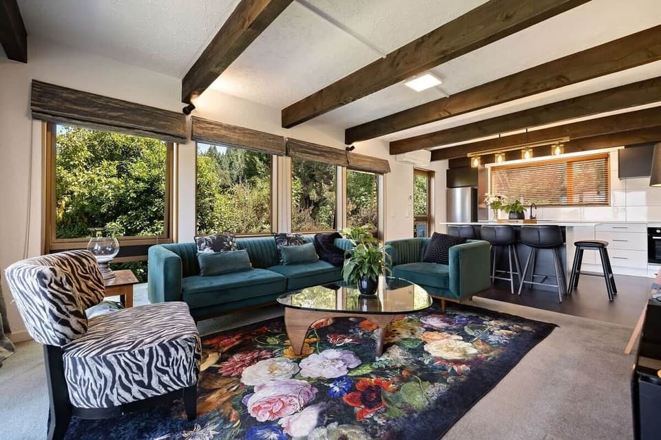 Stylish living area with quality furnishings at Walk to Town 39A Alpine Chalet Queenstown