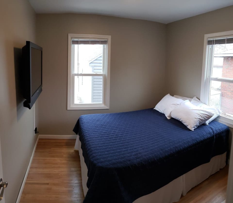 Our first bedroom has a queen sized bed and armoire for storage.