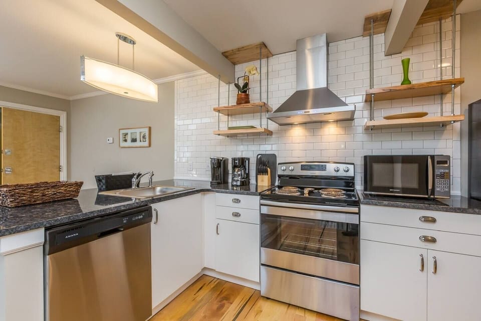 Fully stocked kitchen with granite countertops
