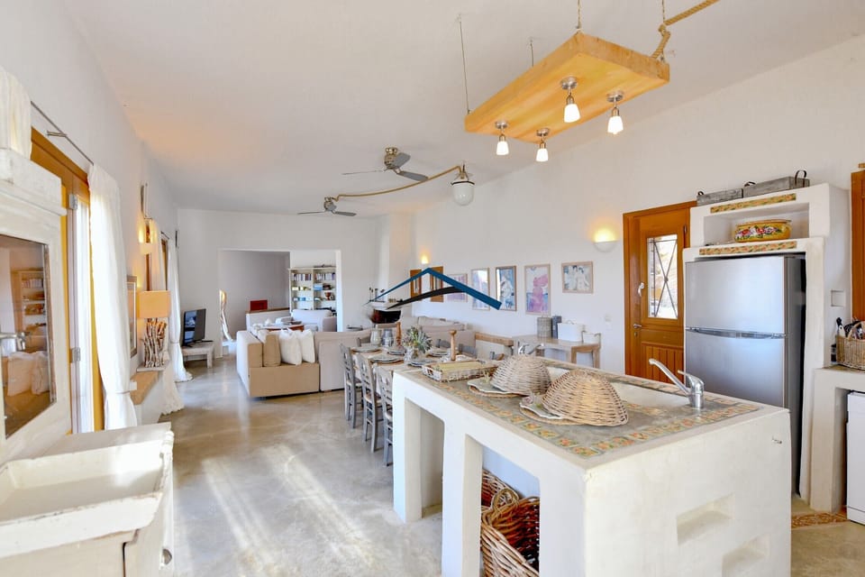 The living room, dining area and kitchen