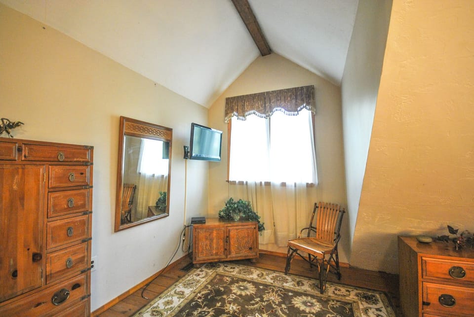 Bedroom furniture - drawers, chair and mirror.