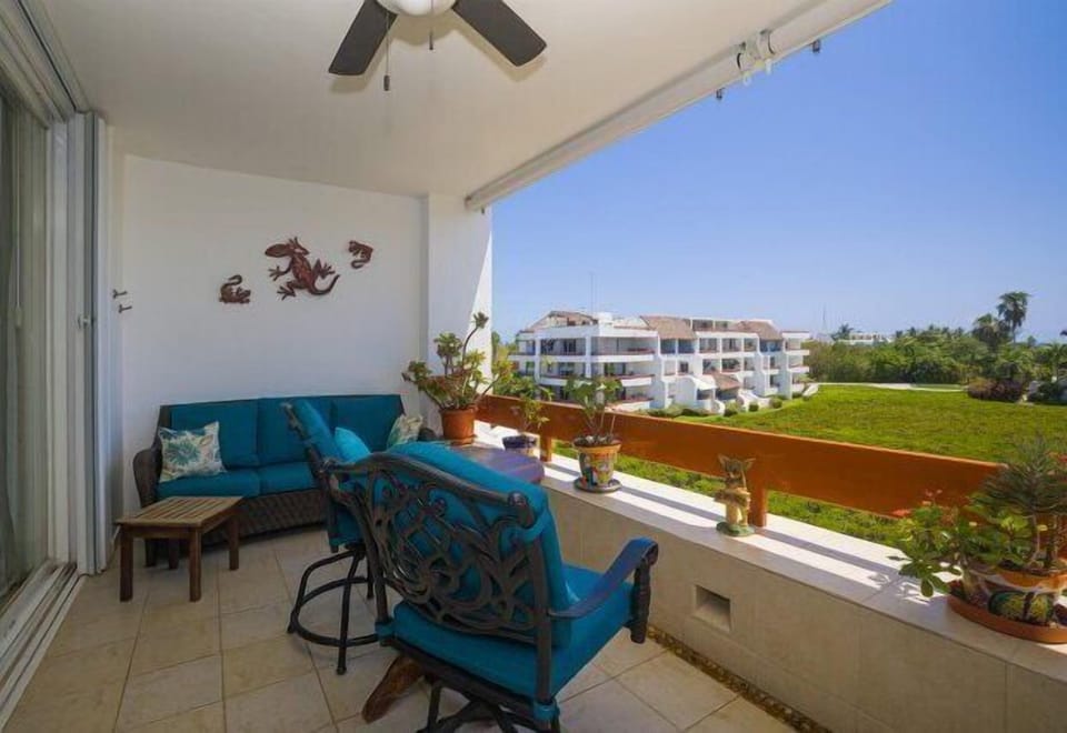 Terrace with small table and seats, expansive ocean views