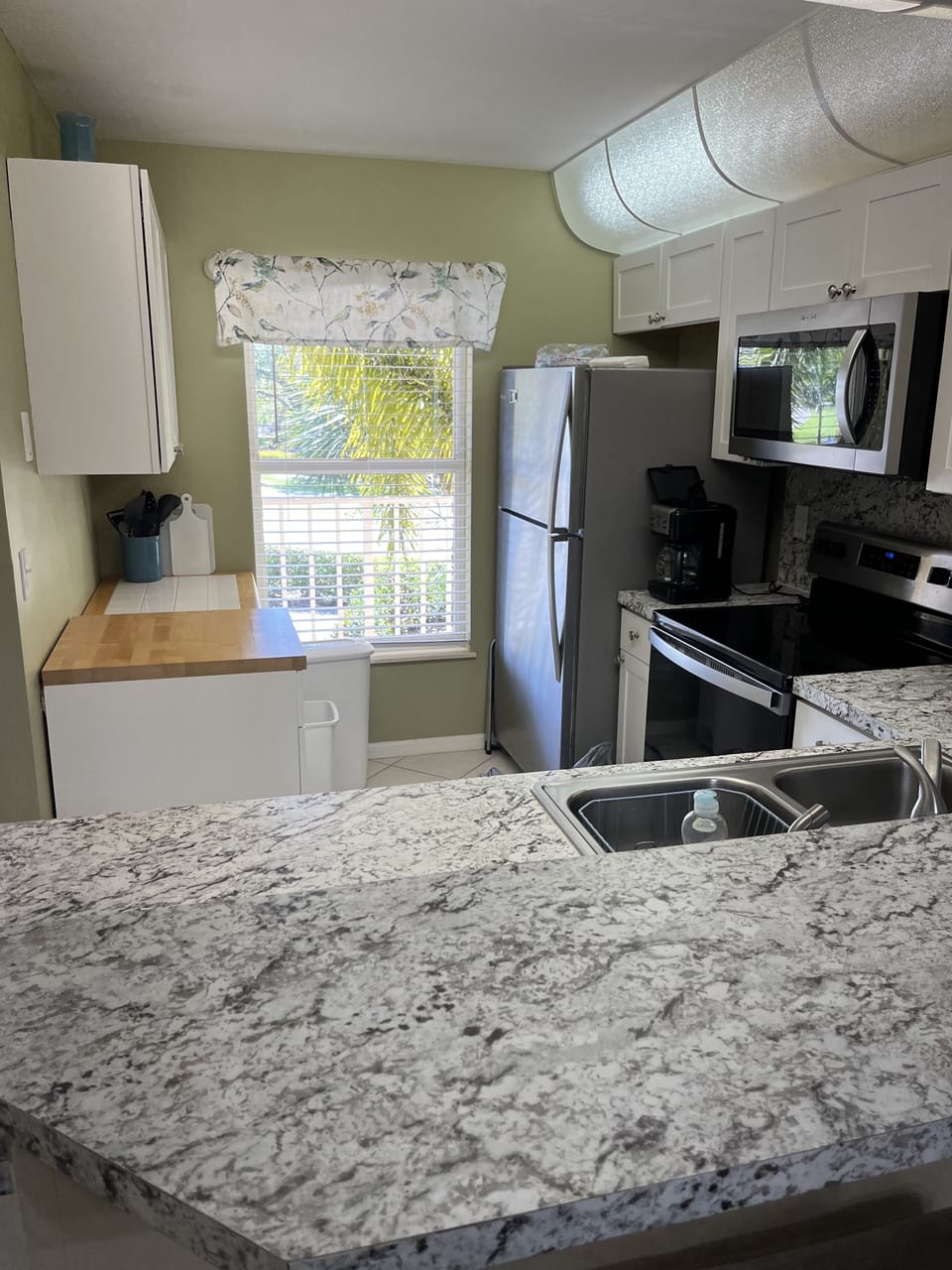 Kitchen looking out to front of condo 