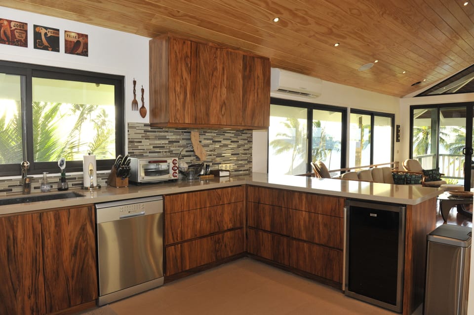Kitchen view including the dishwasher as well as a wine fridge.
