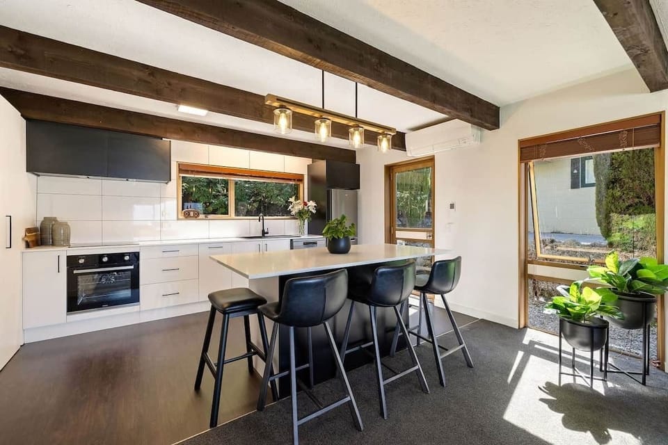 Open plan living with mountain views at Walk to Town 39B Alpine Chalet Queenstown